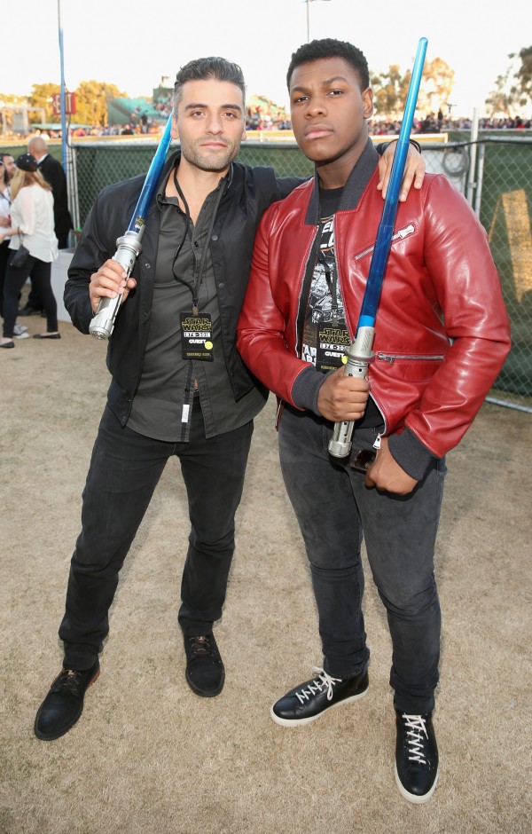 SAN DIEGO, CA - JULY 10:  Actors Oscar Isaac (L) and John Boyega and more than 6000 fans enjoyed a surprise `Star Wars` Fan Concert performed by the San Diego Symphony, featuring the classic `Star Wars` music of composer John Williams, at the Embarcadero Marina Park South on July 10, 2015 in San Diego, California.  (Photo by Jesse Grant/Getty Images for Disney) *** Local Caption *** Oscar Isaac; John Boyega