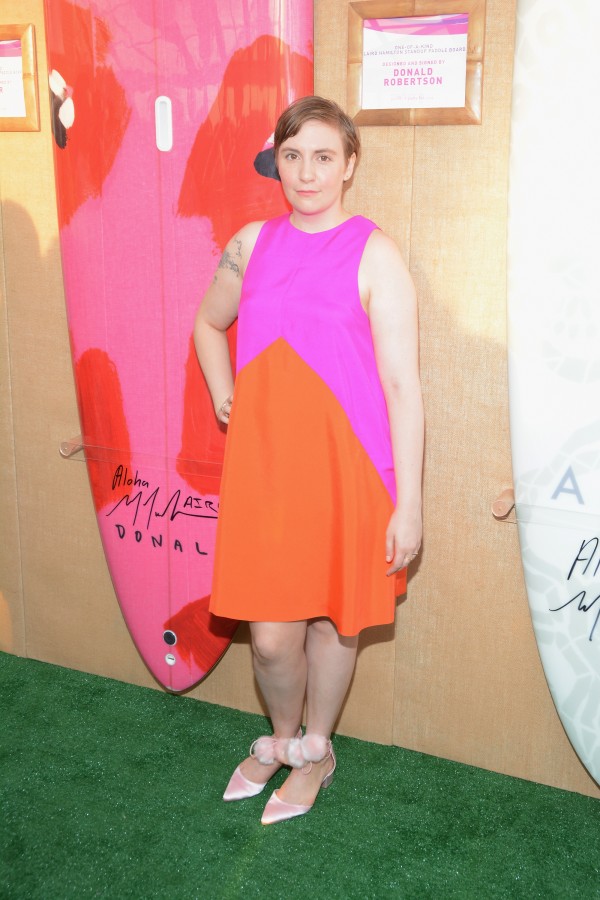 BRIDGEHAMPTON, NY - AUGUST 01:  Lena Dunham toasts to Paddle for Pink with Moet Ice Imperial on August 1, 2015 in Bridgehampton, New York.  (Photo by Steven Henry/Getty Images for Moet & Chandon)