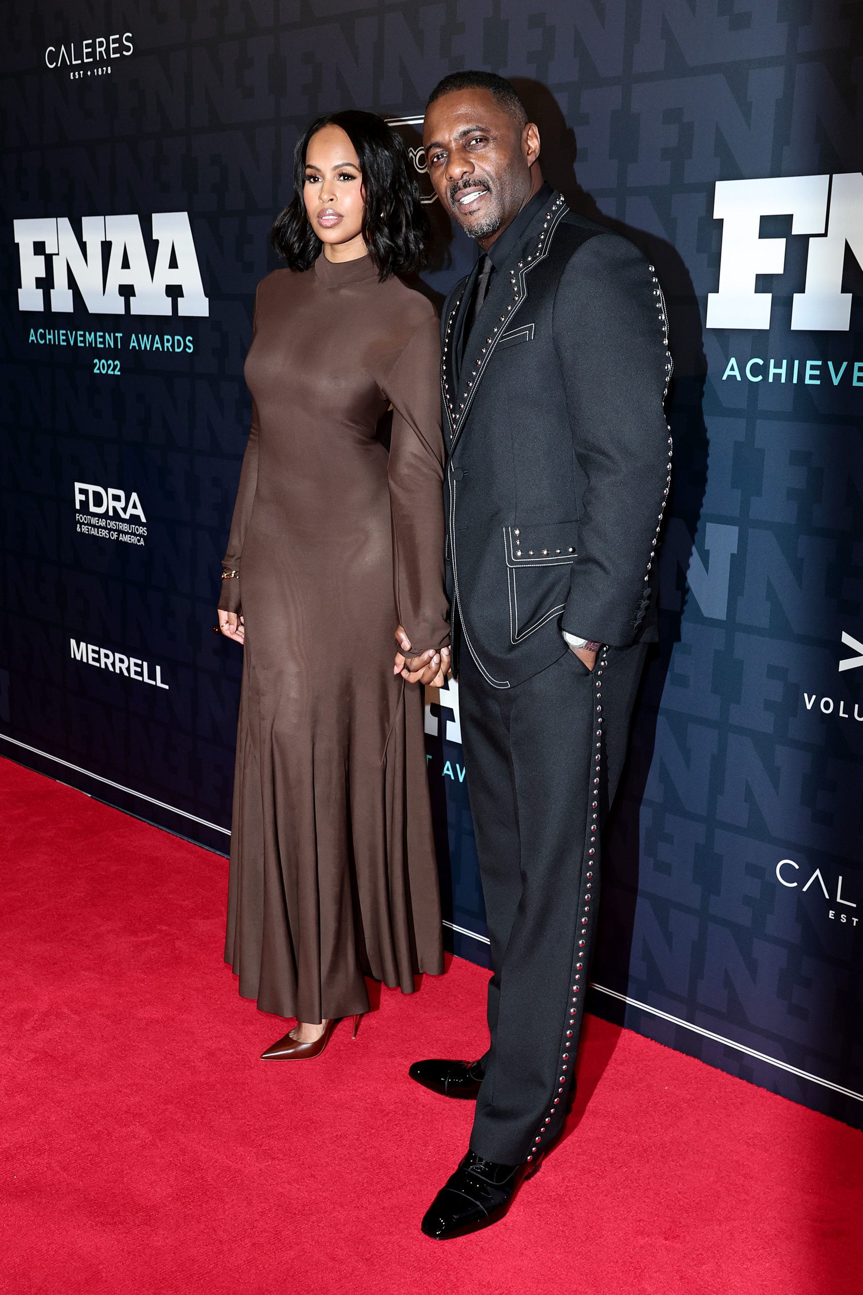 Wardrobe Breakdown: Idris Elba And Sabrina Dhowre At The 36th Annual Footwear News Achievement Awards